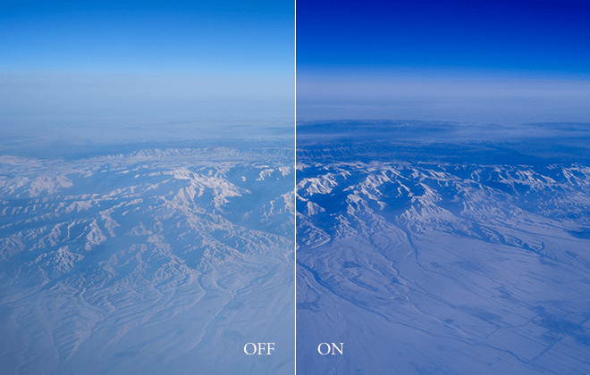 Official Fujifilm off/on comparison of Color Chrome FX Blue deepening the blue tones of aerial mountains